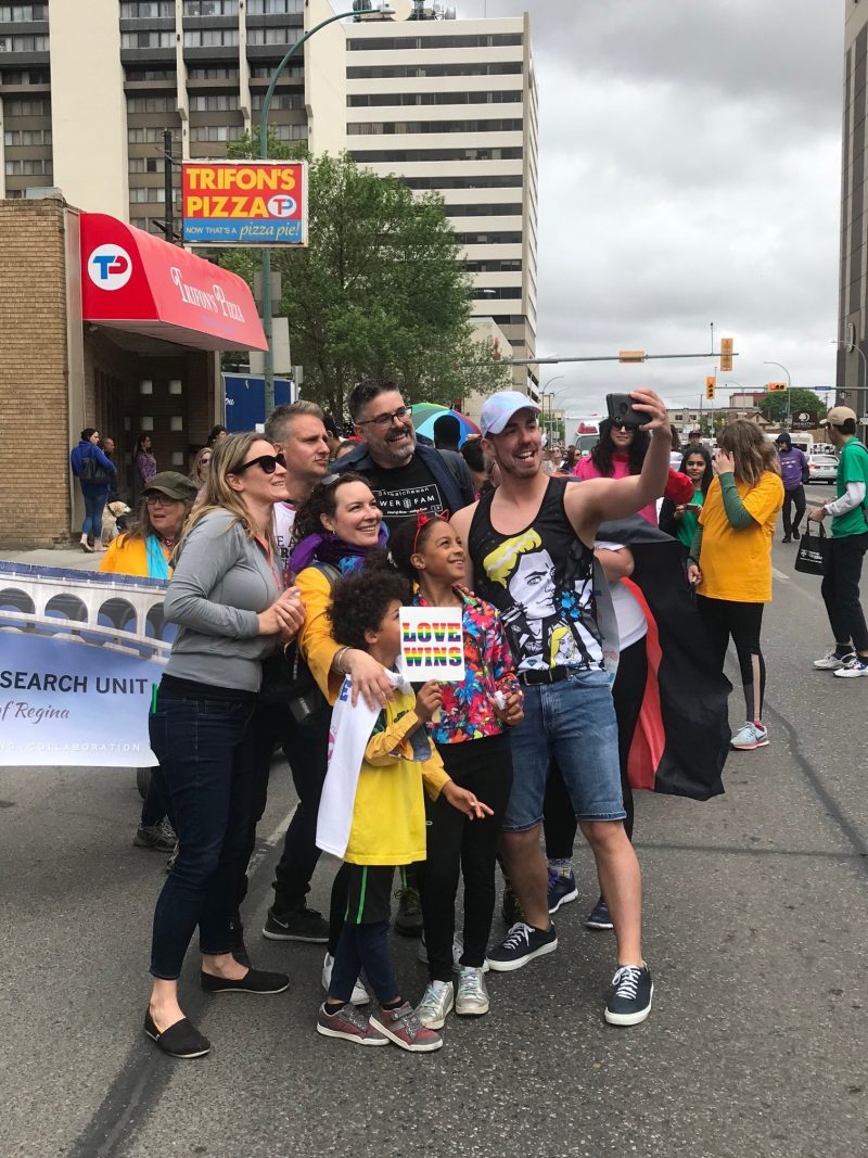 A photo of URFA equity committee members in the 2019 Queen City Pride parade.